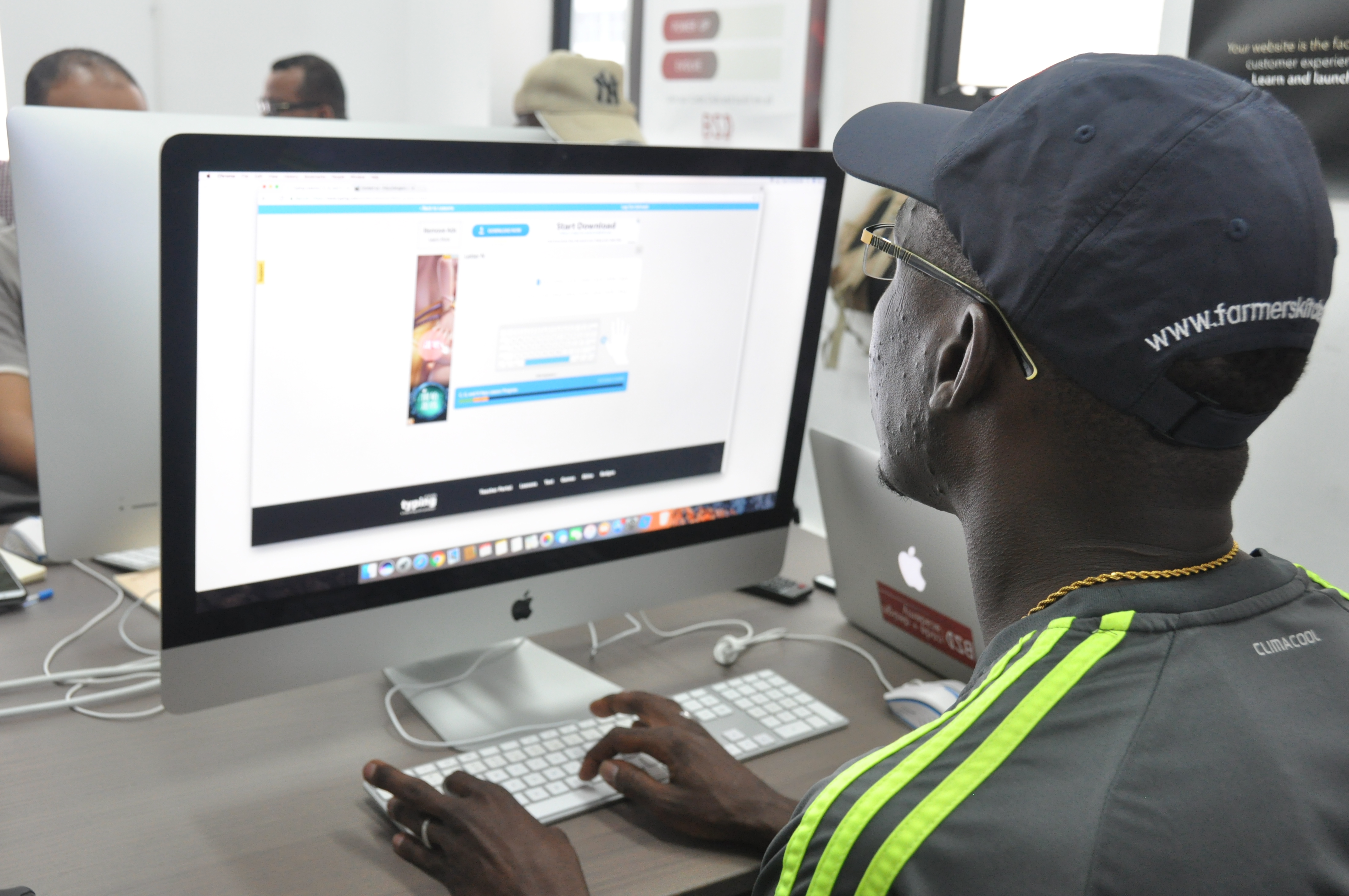 Students working on a RefuGeek ecommerce project in partnership with Grassroots Future
